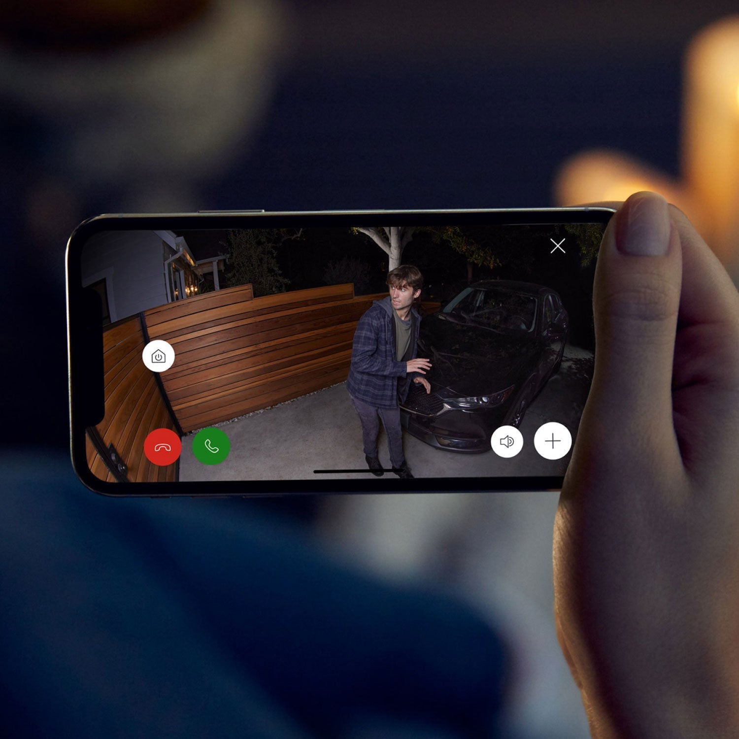 Spotlight Cam Plus - Battery:Live Ring Spotlight Cam Plus footage of suspicious person near a car at night, with app controls visible on screen.