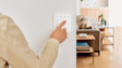 Finger pressing a button on a Ring Alarm Keypad