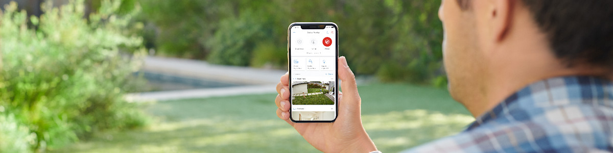 Person using mobile app outdoors with nature in background